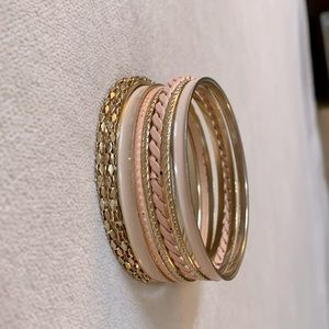 Set of peachy pink and gold bracelets